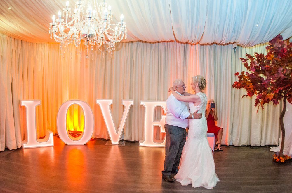 First dance next to love sign,  Hotel Van Dyk wedding photography Chesterfield