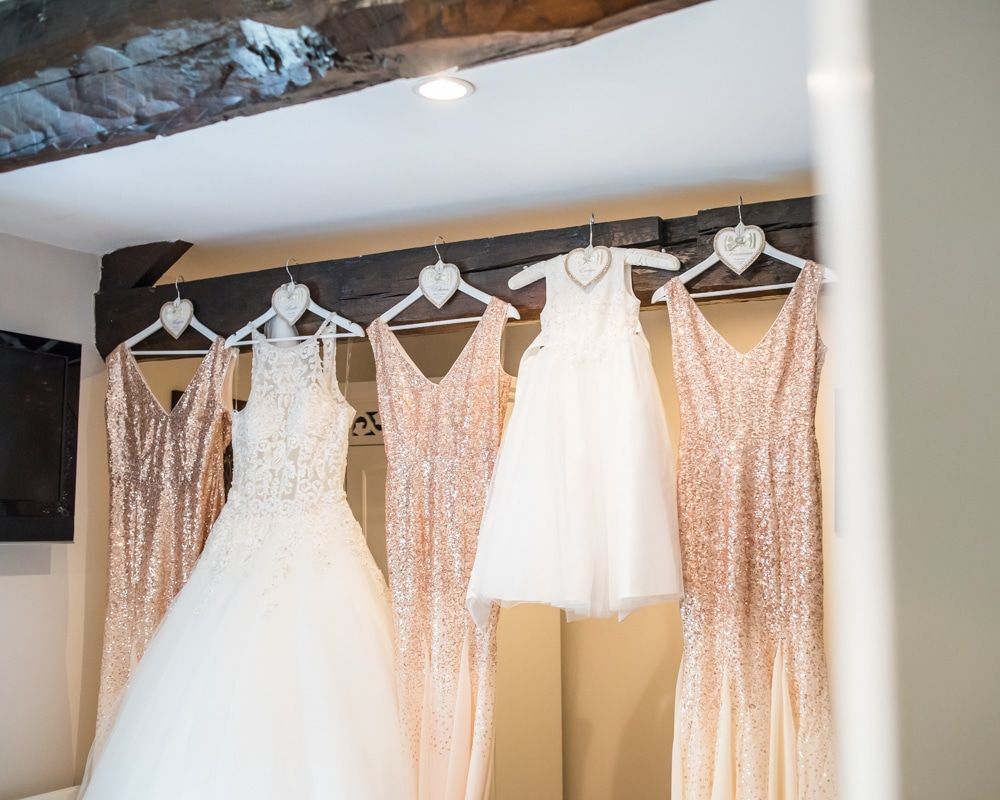 Bride and bridesmaids dresses hanging up, Waterton Park Hotel weddings, Yorkshire wedding photographers