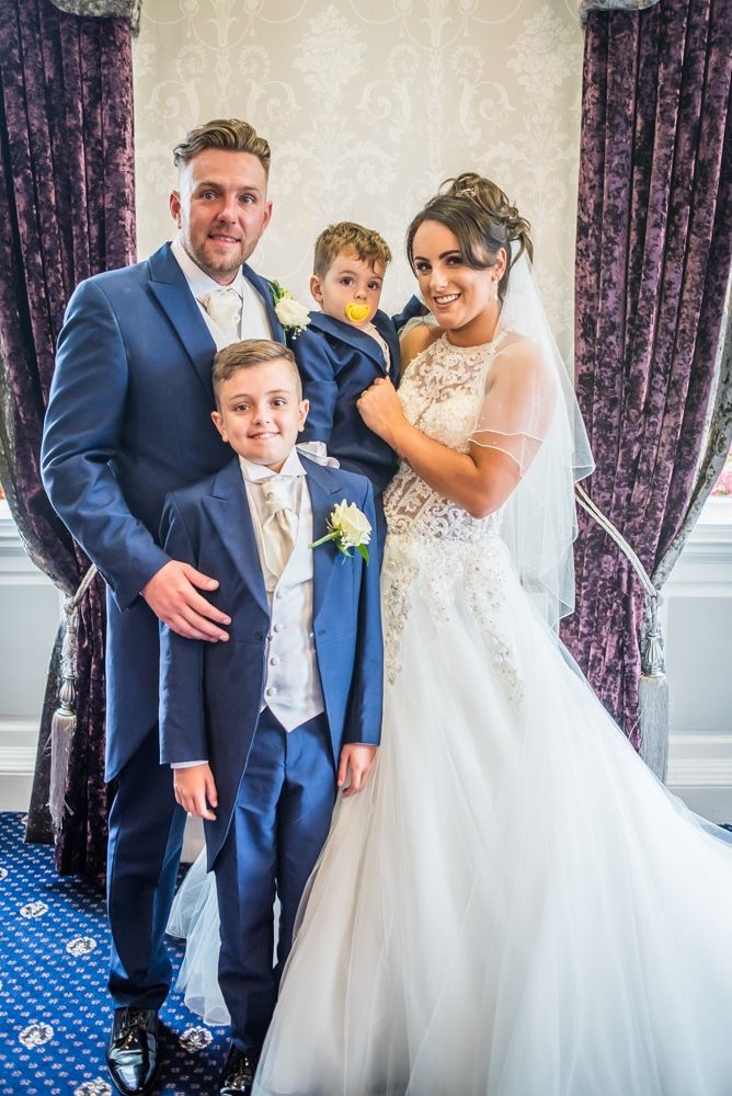 Group photo with their sons, Waterton Park Hotel weddings, Yorkshire wedding photographers