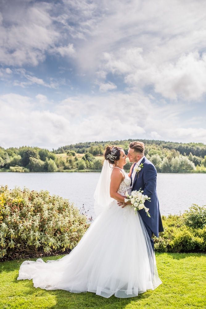 Posing by the lake in the grounds, Waterton Park Hotel weddings, Yorkshire wedding photographers