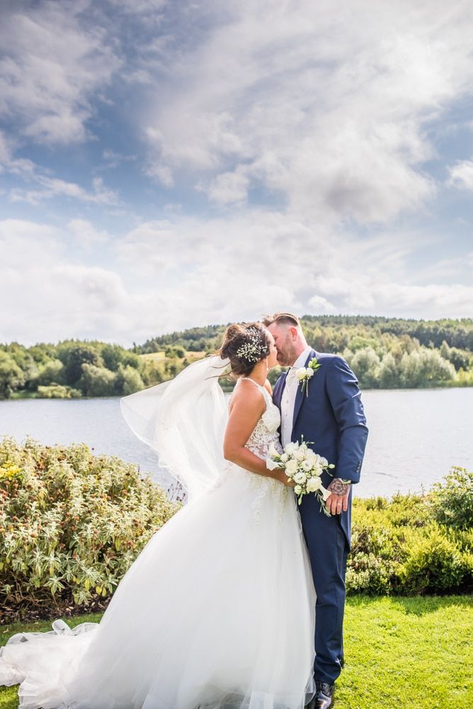 Kisses in the grounds, Waterton Park Hotel weddings, Yorkshire wedding photographers