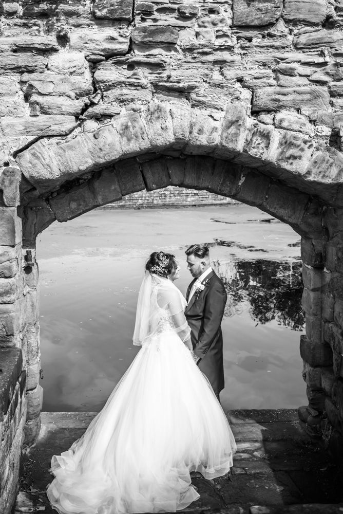 Under the arch by the lake, Waterton Park Hotel weddings, Yorkshire wedding photographers