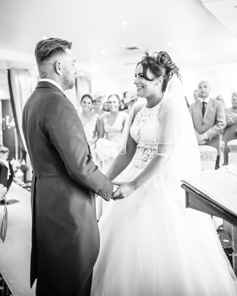 Holding hands in ceremony, Waterton Park Hotel weddings, Yorkshire wedding photographers