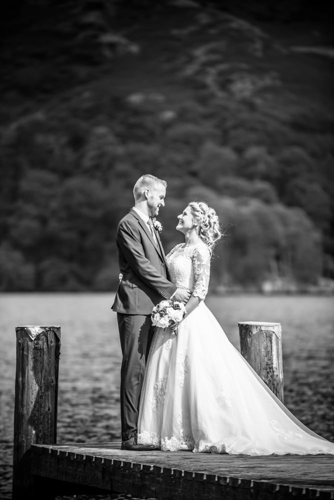 Bride and groom on jetty, Inn on the Lake Weddings, Lake District