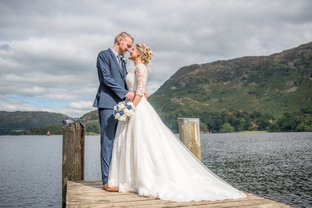 On jetty with lake in background, Inn on the Lake Weddings, Lake District