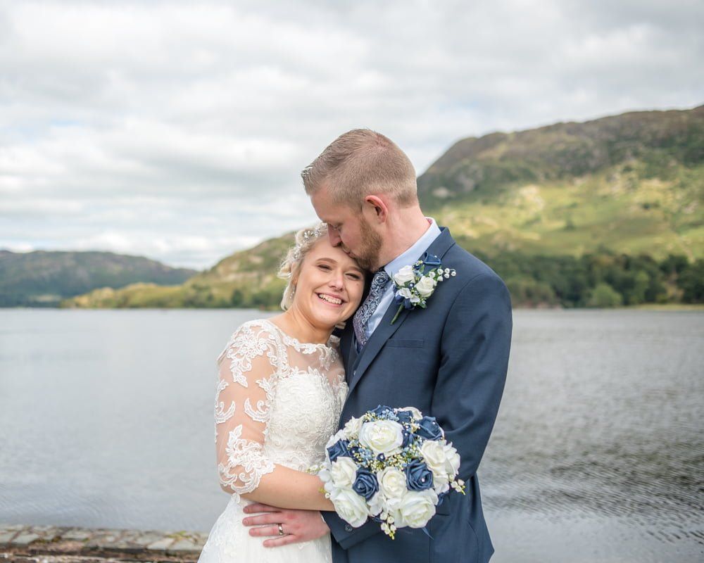 Kisses for bride, Inn on the Lake Weddings, Lake District