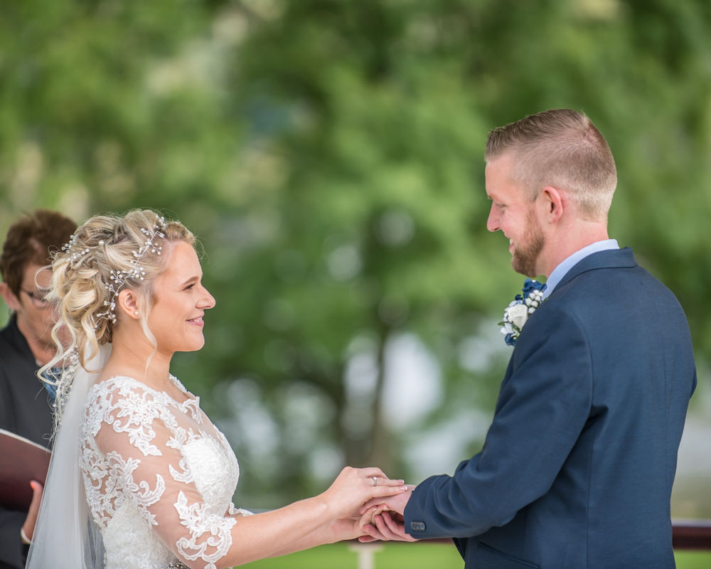 Bride and groom looking at each other in ceremony, Inn on the Lake, Ullswater, Lake District wedding photography