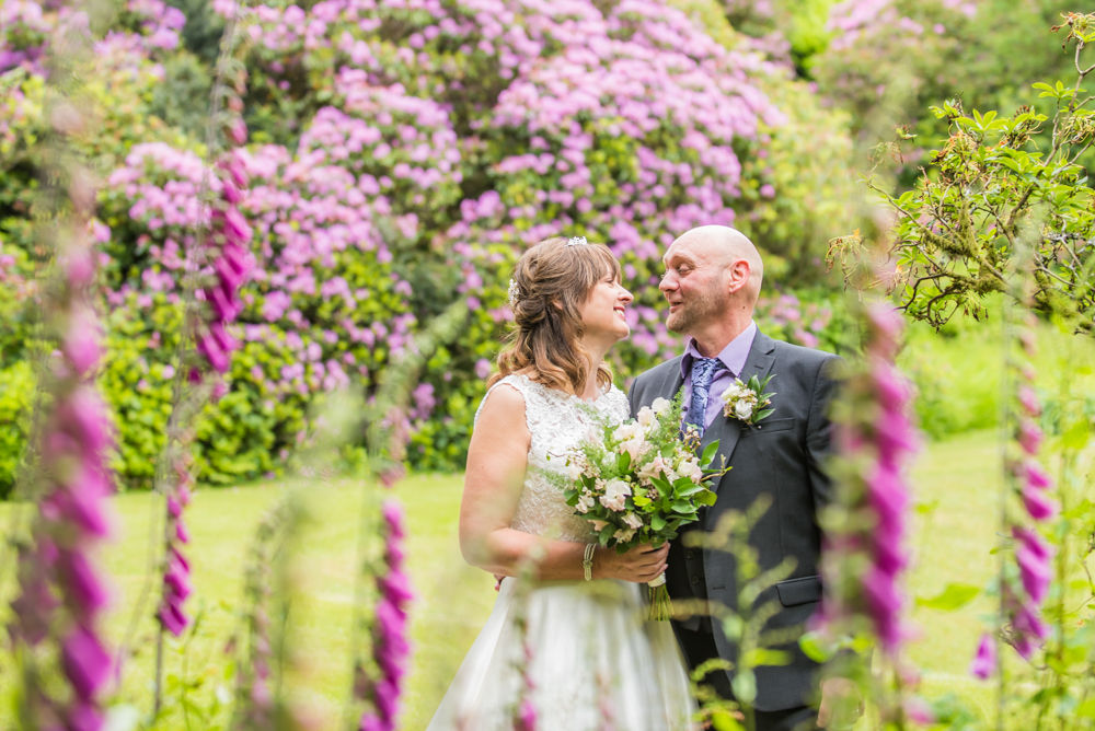 Bride and groom looking at each other, Merewood House, Windermere, Lake District wedding photographers