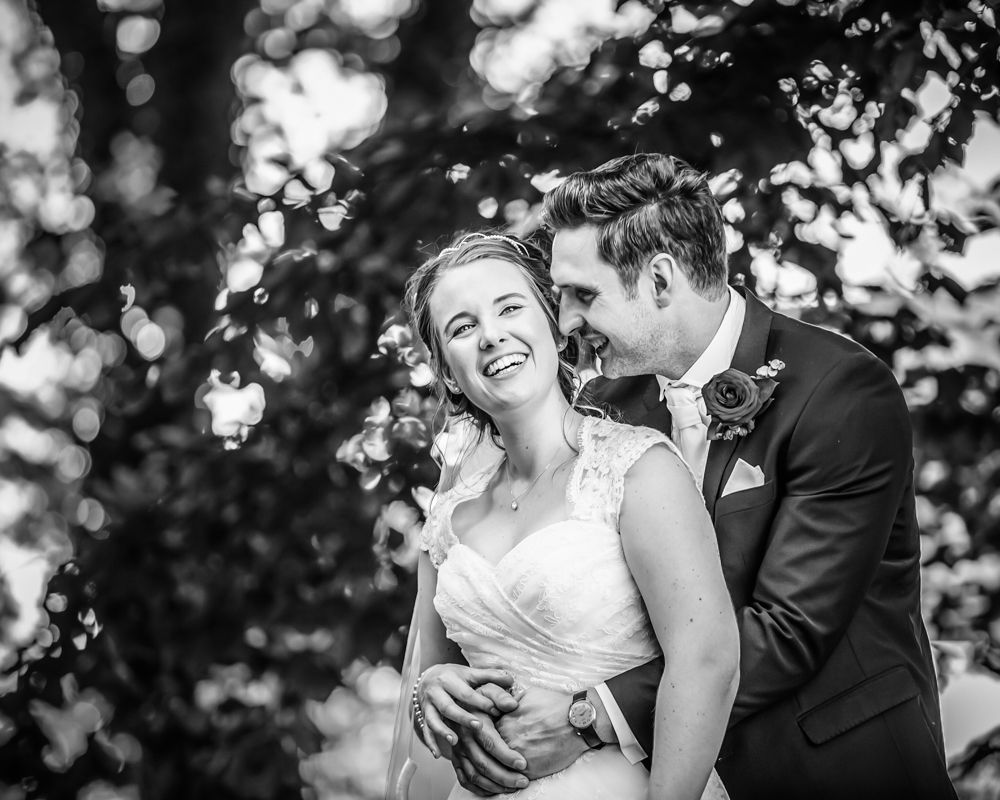 Cuddles in venue grounds, alternative wedding photographers Sheffield