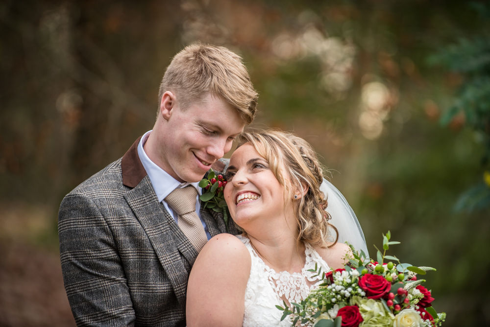 Smiles for bride and groom in gardens, Grange Hotel, Grange over Sands Lake District wedding photographers