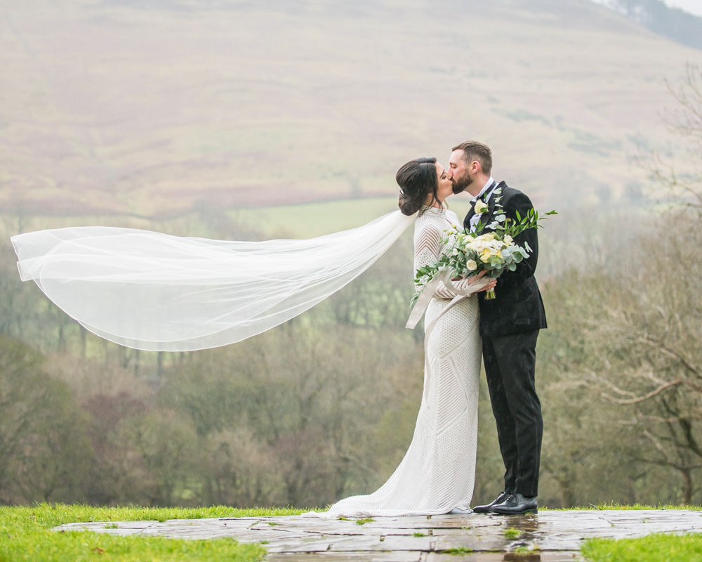 Kisses with veil blowing, Losehill House weddings, Sheffield wedding photography