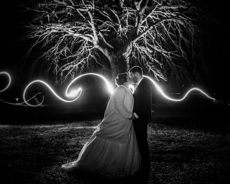 Bride and groom in front of light trails at nightime, The Villa Levens wedding photography, Kendal, Cumbria