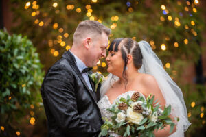 Bride and groom touch noses, Abbey House Hotel wedding, Barrow, Cumbria