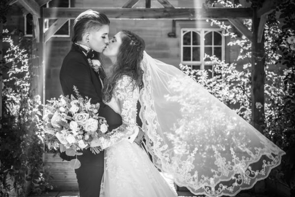 Vicky & Demi kissing under pagoda, Carlisle register office wedding, Cumbria, same sex wedding