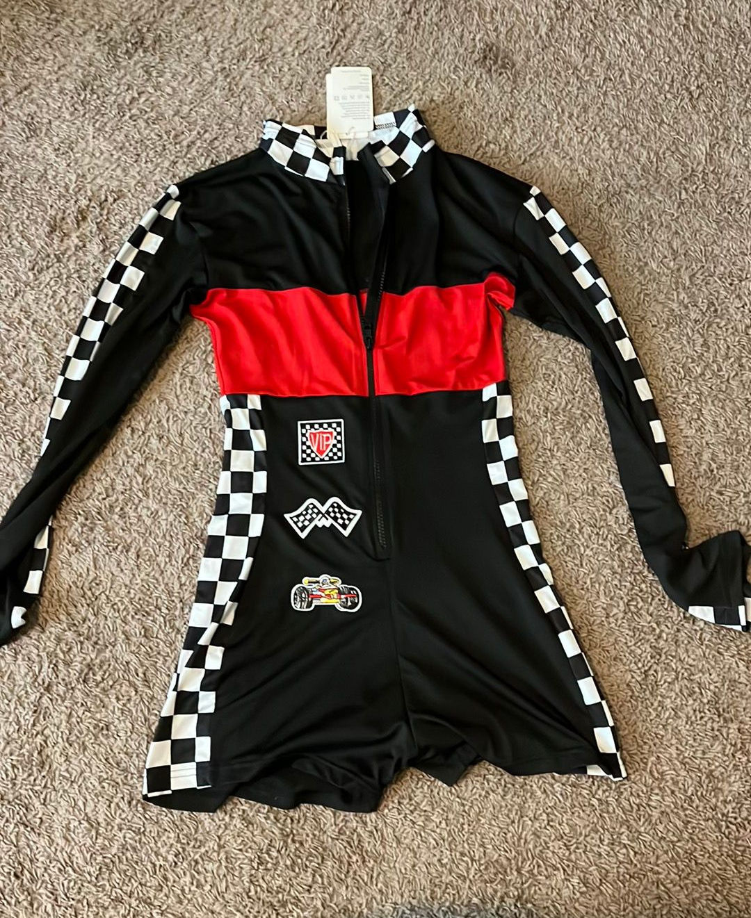 Black-and-red racing jumpsuit costume with checkered trim and racing patches.