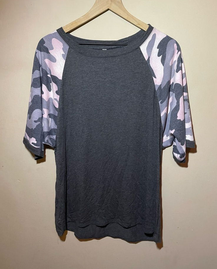 Charcoal tee with playful pink and gray camo raglan sleeves.