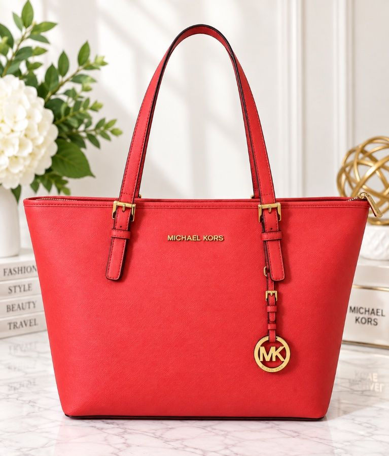 Coral saffiano leather work tote with long shoulder straps and a zip-top closure.