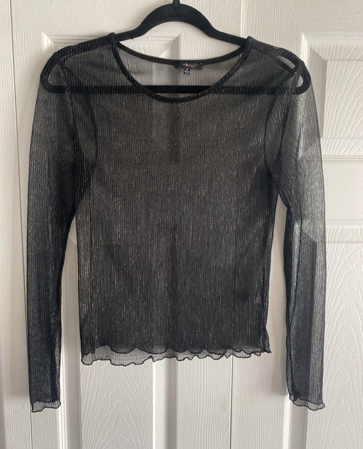 Black sheer pleated mesh long-sleeve top with visible transparent texture.