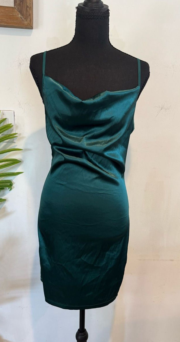 Emerald satin cowl-neck mini dress displayed on a mannequin.