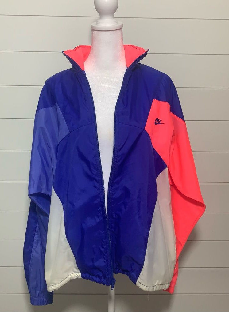 Vintage Nike color-block windbreaker in cobalt blue, white, and red.