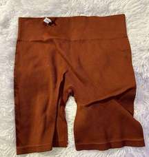 #7 Gilly  Hicks size large burnt orange spandex b8