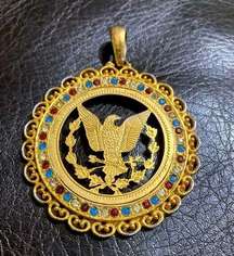 Vintage gold-tone American Eagle pendant with red, white, and blue gemstones