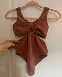 NWOT Sugar Rain  body suit. size S/M. never Worn before