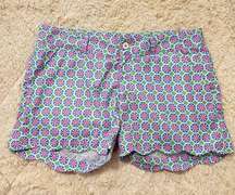 Birdies and Bows | green blue and pink patterned scalloped golf shorts