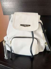 New  Olive White Mini Bsolly Backpack Black Wide Adjustable Strap  3 Pockets with zipper sides and front  New with tag  Same day shipping  Smoke and pets free  10*10*6” inches  Looking for a stylish and practical backpack? Check out this  Olive White Mini Bsolly Backpack. With a solid pattern and white exterior color, this backpack is perfect for women who love to travel light. It features a zip, tie, and magnetic closure, making it easy to access your belongings. The bag dimensions are 10 inches in width, 10 inches in height, and 6 inches in depth, with an adjustable black strap accentuated with gold hardware.   The exterior of the backpack is made of Nylon material, with a black lining color. It also has inner and outer pockets, perfect for organizing your items. This backpack is a great addition to your wardrobe, perfect for any occasion, whether you are out running errands or attending a casual event.