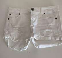 White ripped shorts