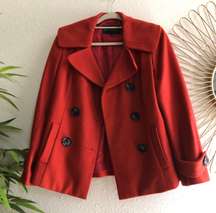 Red wool pea coat with double breasted buttons and collar, fully lined