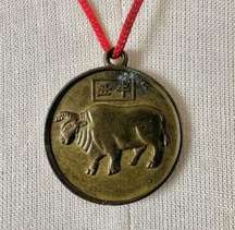 Year of the ox good luck Chinese zodiac pendant necklace on red cord