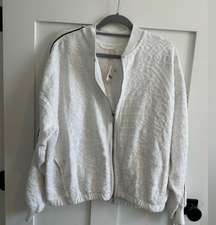 Fp movement by Free People white embroidered zip up jacket with black stripe Lg