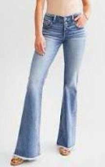 Shaping and smoothing pocketing bell bottom jeans, size 11/27 by Buckle Black