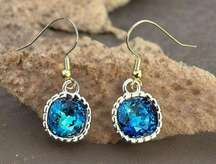 Earrings made with Bermuda Blue Swarovski crystal and gold earwires handcrafted