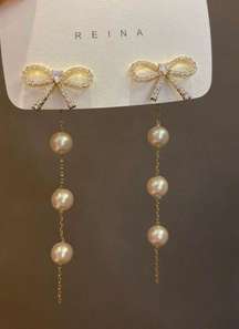Elegant Bow White Pearl Dangle Drop Earrings for Women 9 New with tags! This delicate pearl drop earrings make for an 