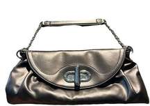 Daisy Fuentes NWOT bronze handbag with silver details