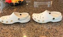 White crocs. Gently used. Small scuffs in pictures.