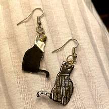 Aluminum cat-shaped earrings made out of soda cans