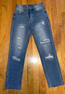 Distressed denim jeans 