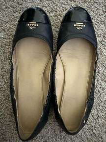 Black leather Coach ballet flats