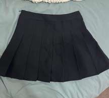 black pleaded skirt