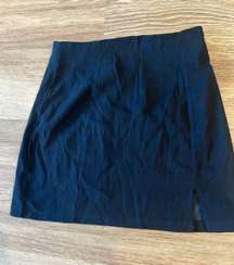 Short black pencil skirt with small slit