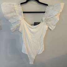 Les Lis Women's Ruffled Ribbed Bodysuit Size Large Creamy White One Piece NWT