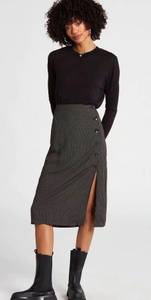 NWOT- So cute pencil skirt, black with small polka dots, front off side buttons with slit, back waistband is elastic, excellent condition, never been worn, size medium (8)