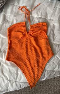 orange bodysuit 