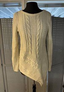 .
Dana Bachman M cream and silver sweater with necklace