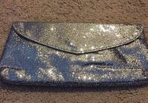 NWT silver sparkle mesh clutch.