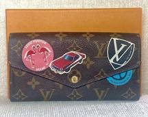 Louis Vuitton LIMITED EDITION  Monogram World Tour Sarah Wallet