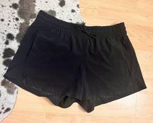 Athleta  Black Running Shorts Size 8 Laser Cut Hem